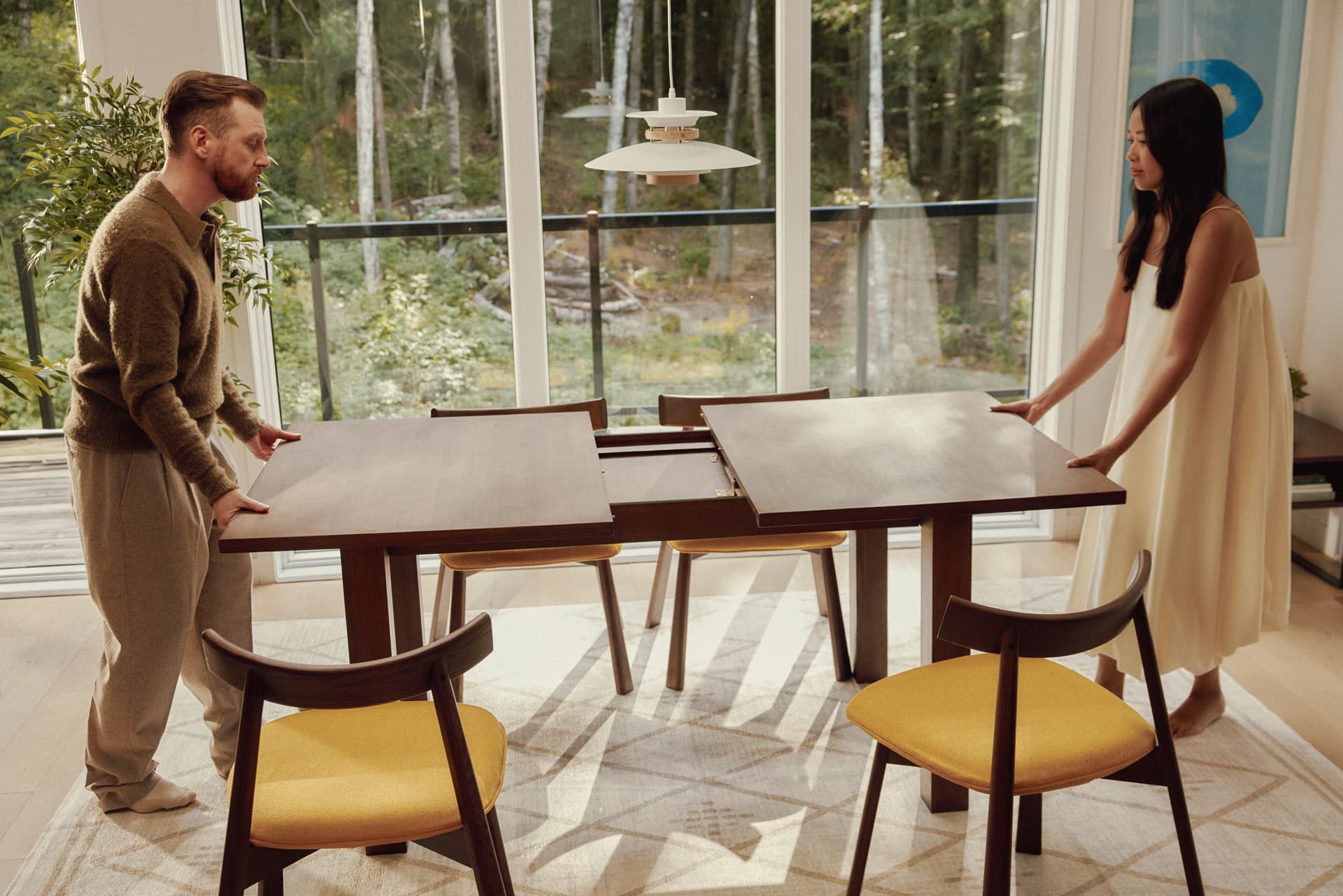 A Cozey Ushi dining table with its extension leaf in place