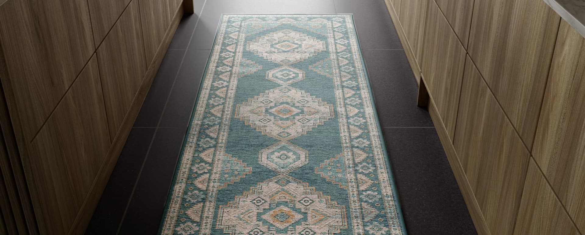 Teal patterned washable rug runner in a dark hallway with wooden cabinetry