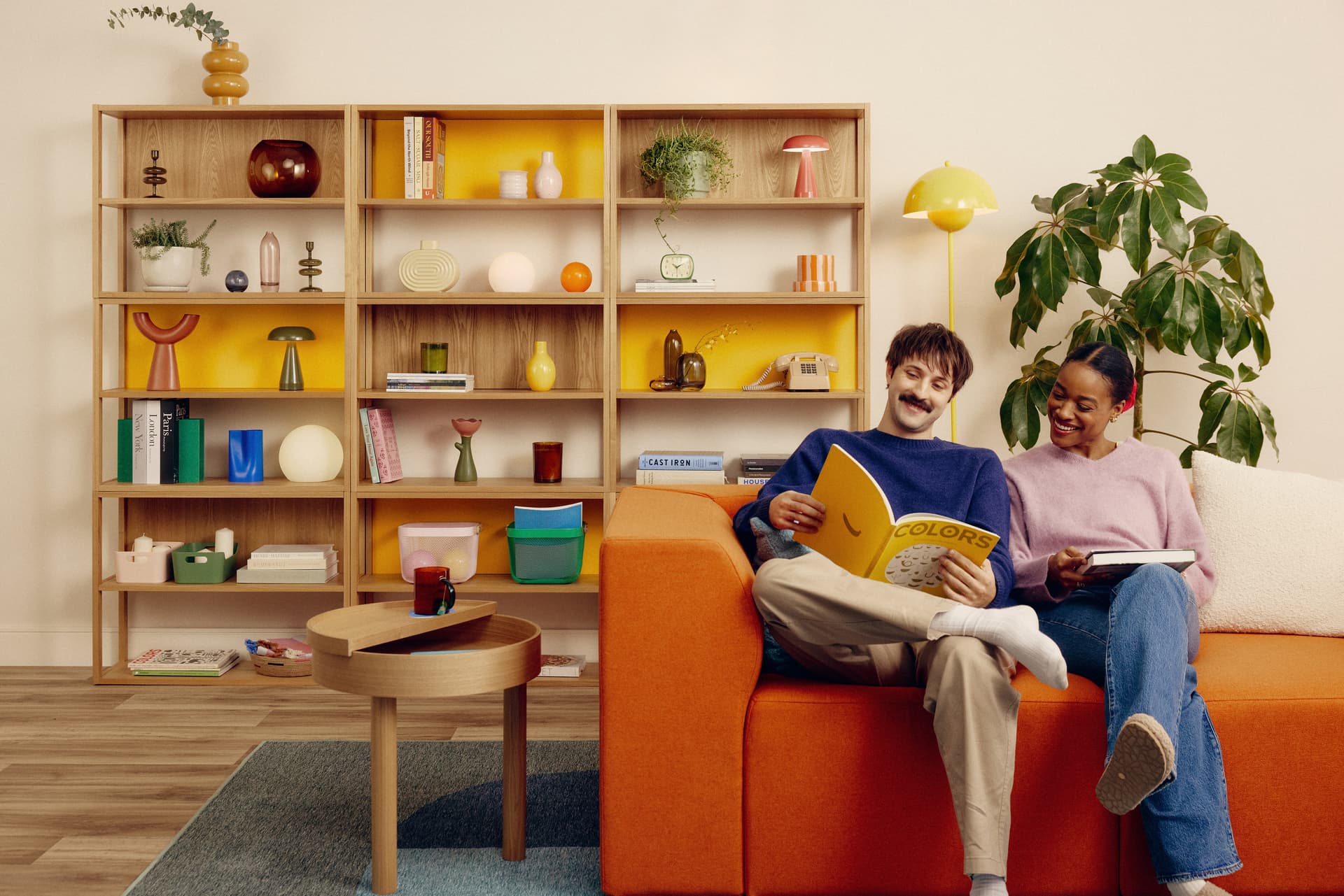 Two people sitting in their living room